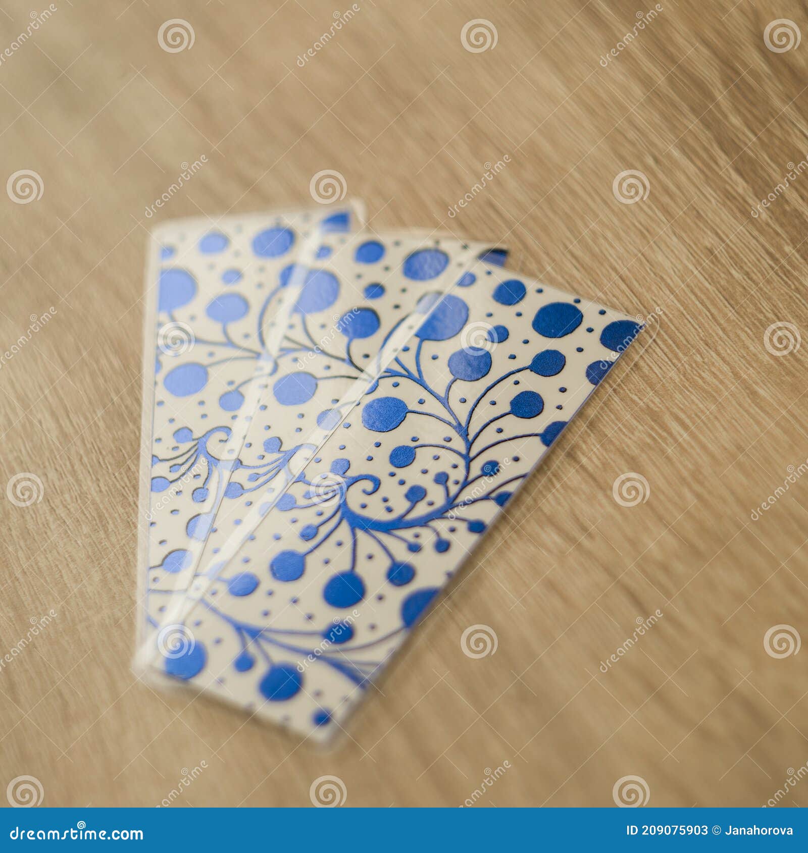 blue-metallic-bookmarks-table-wooden-209075903